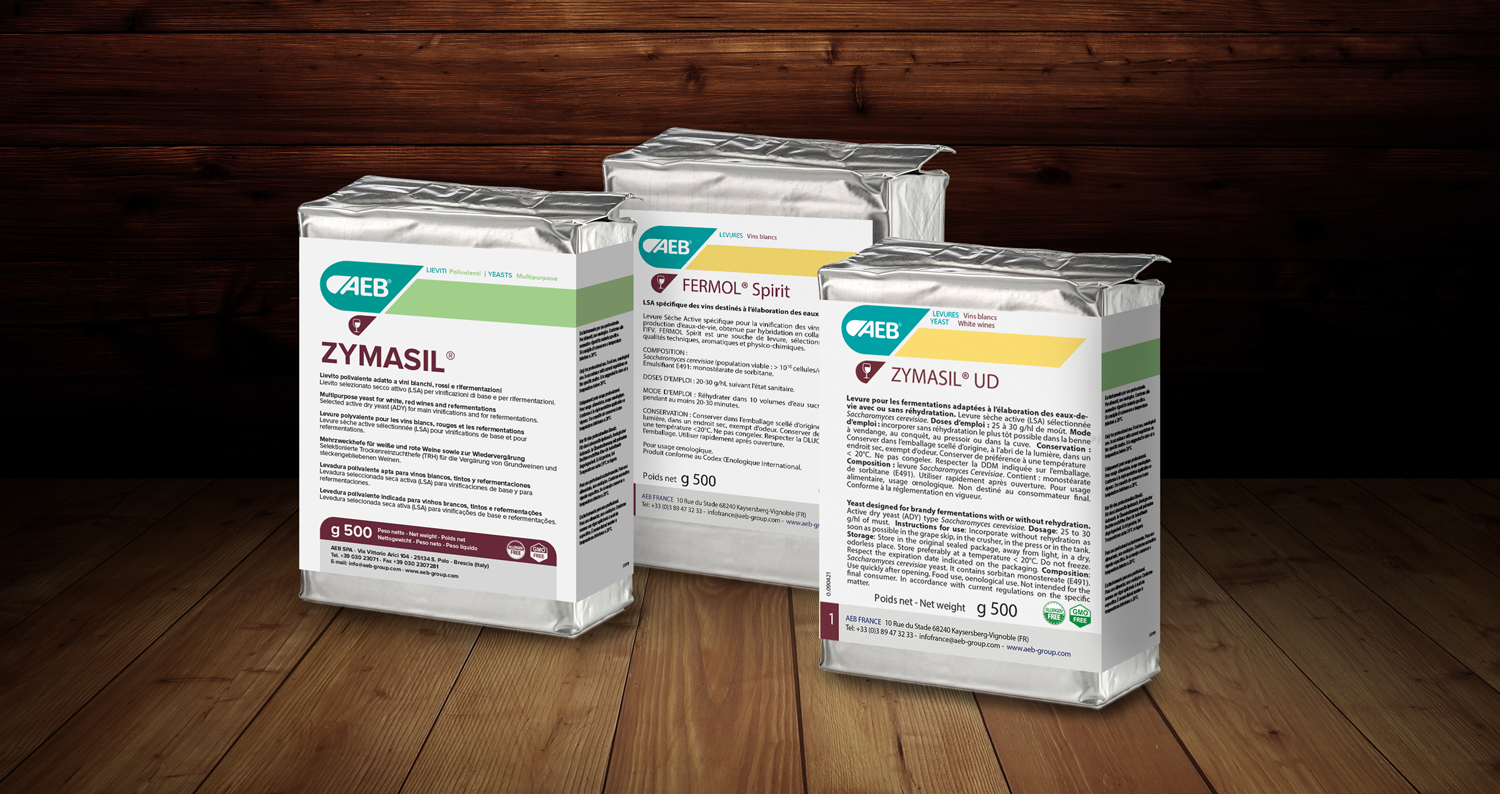 Cognac range packets placed on wooden counter top “Image of 3 product packets on a wooden counter”